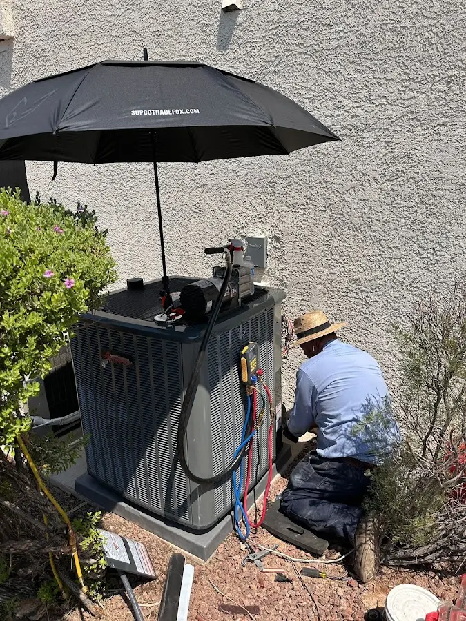 HVAC technician performing outdoor AC maintenance in Islamorada, Village of Islands