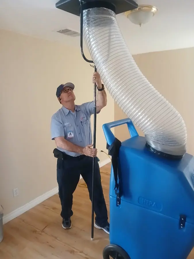 Furnace Tune-Up technician using HEPA equipment in Islamorada, Village of Islands